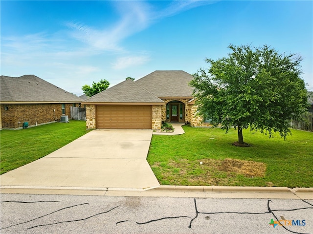 412 Coventry Dr, Temple, TX 76502 - view of front of home featuring an attached garage, a front yard, concrete driveway, and brick siding