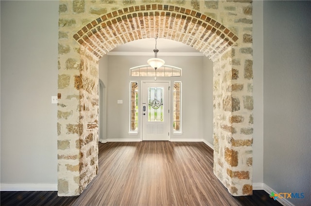 412 Coventry Dr, Temple, TX 76502 - entrance foyer with arched walkways, wood finished floors, and crown molding