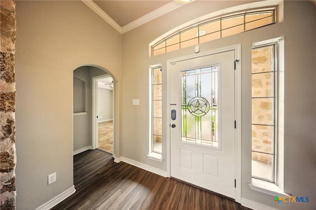 412 Coventry Dr, Temple, TX 76502 - foyer featuring ornamental molding, arched walkways, and dark wood-style floors