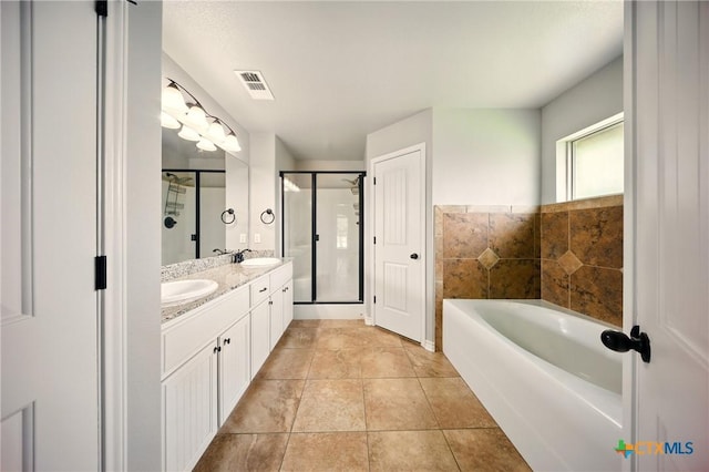 412 Coventry Dr, Temple, TX 76502 - full bathroom featuring double vanity, a garden tub, a stall shower, and tile patterned flooring