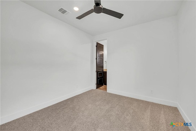 carpeted empty room with ceiling fan