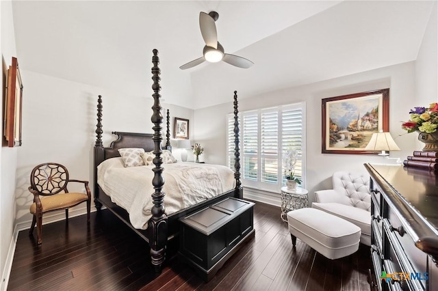 bedroom with dark wood-type flooring, vaulted ceiling, baseboards, and ceiling fan