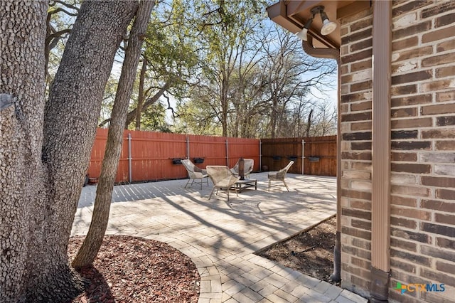 view of patio with a fenced backyard