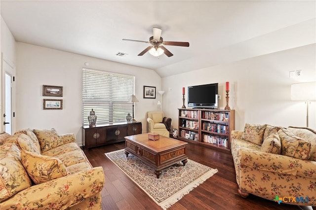 living room with lofted ceiling, ceiling fan, visible vents, and wood finished floors