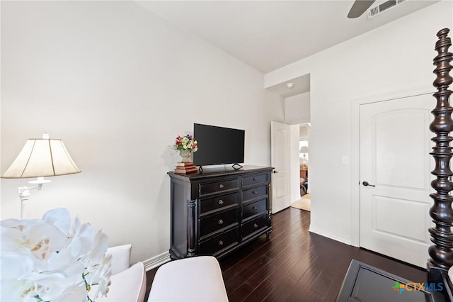 bedroom featuring dark wood-style floors, baseboards, and visible vents