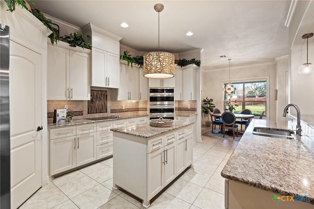 kitchen featuring double oven, black electric stovetop, a sink, and ornamental molding