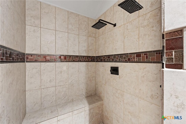 full bath with a tile shower