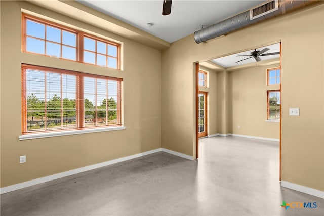 unfurnished room with concrete flooring and ceiling fan