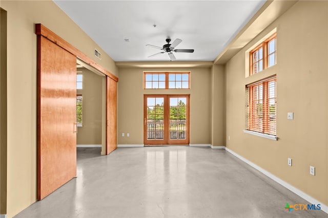 unfurnished room with ceiling fan