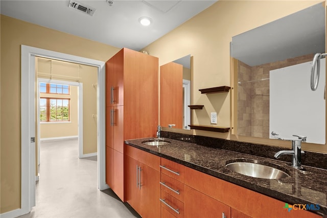 bathroom with concrete flooring and vanity