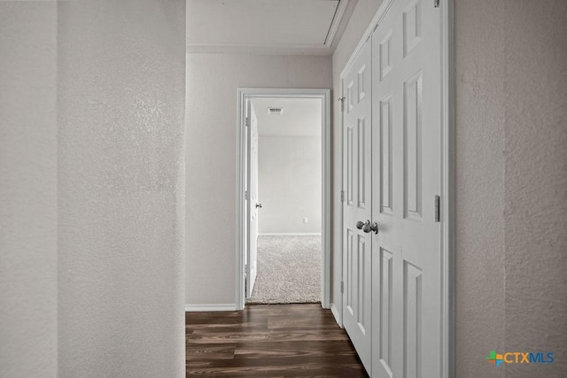 5712 Stonehaven Dr, Temple, TX 76502 - corridor with a textured wall, dark wood-type flooring, attic access, and baseboards