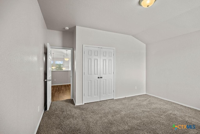 5712 Stonehaven Dr, Temple, TX 76502 - unfurnished bedroom with carpet, a closet, baseboards, and vaulted ceiling