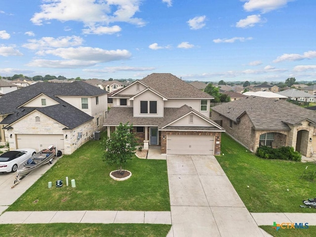 5712 Stonehaven Dr, Temple, TX 76502 - view of front of property with concrete driveway, a residential view, a front yard, and a shingled roof