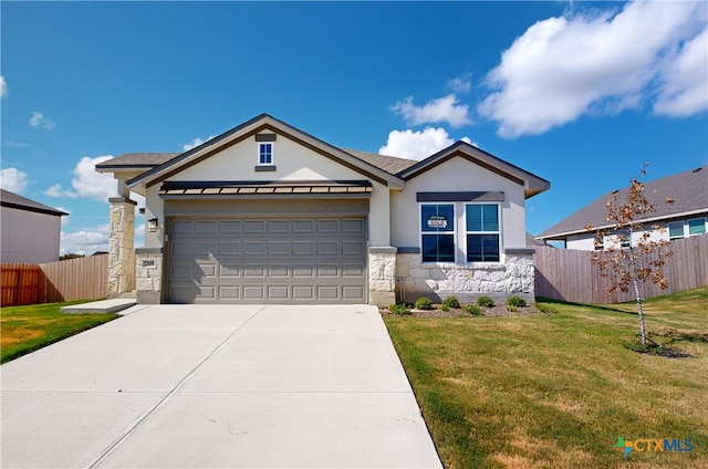 view of front of house with a garage and a front yard