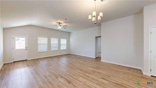 unfurnished living room with ceiling fan with notable chandelier, light hardwood / wood-style flooring, and lofted ceiling