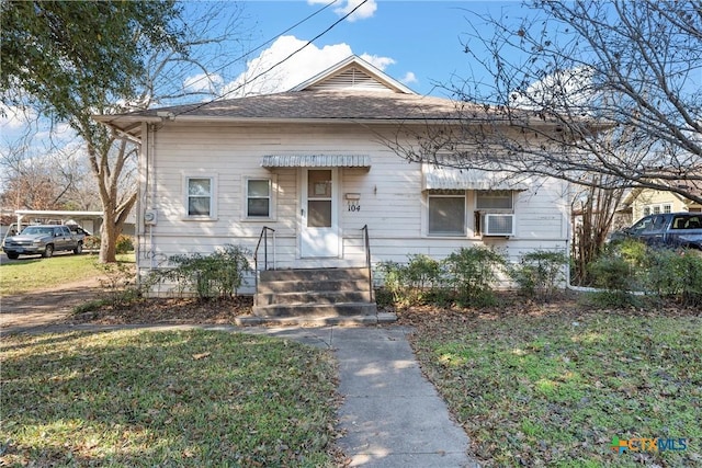 bungalow with a front yard