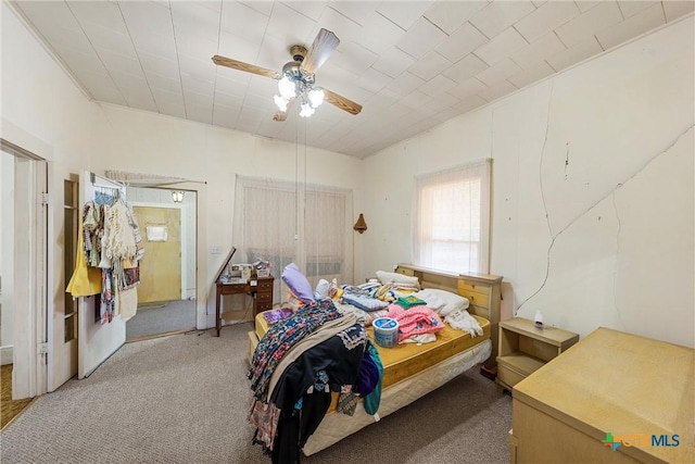 bedroom with light carpet and ceiling fan