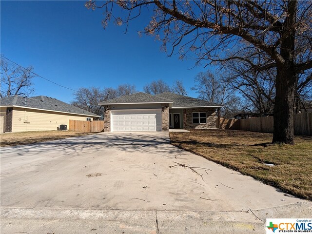 single story home featuring a garage