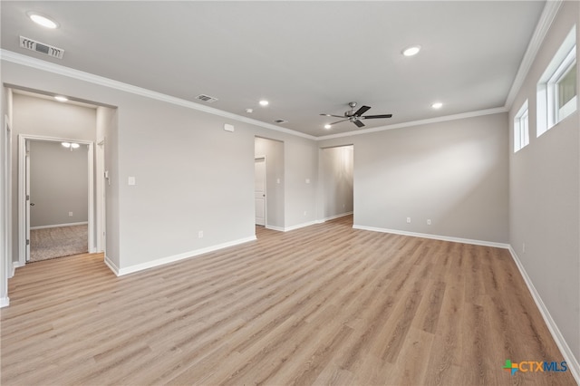 empty room with ornamental molding, light wood-type flooring, and ceiling fan