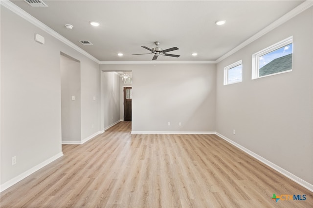 empty room featuring ceiling fan, light hardwood / wood-style flooring, and crown molding