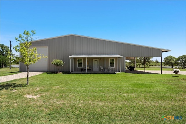view of front of home with a porch, driveway, and a front yard
