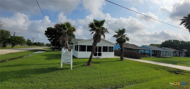 101 E Saint Louis Ave, Seadrift, TX 77983 - ranch-style home with driveway and a sunroom