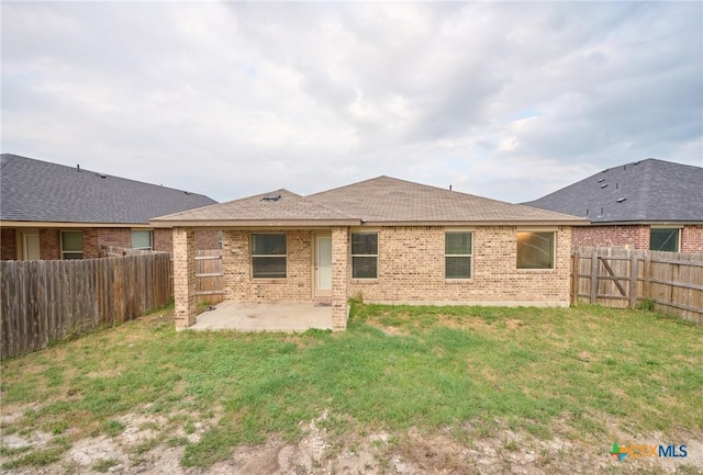 6409 Katy Creek Ln, Killeen, TX 76549 - back of house with a patio, brick siding, and roof with shingles