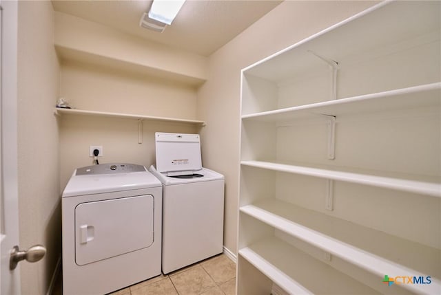 6409 Katy Creek Ln, Killeen, TX 76549 - laundry room with washer and clothes dryer and light tile patterned floors