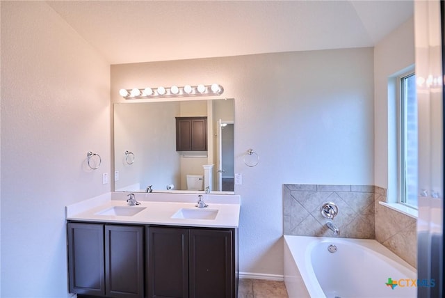 6409 Katy Creek Ln, Killeen, TX 76549 - full bath featuring a garden tub, double vanity, and baseboards
