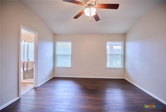 6409 Katy Creek Ln, Killeen, TX 76549 - spare room featuring lofted ceiling, dark wood-type flooring, ceiling fan, and baseboards