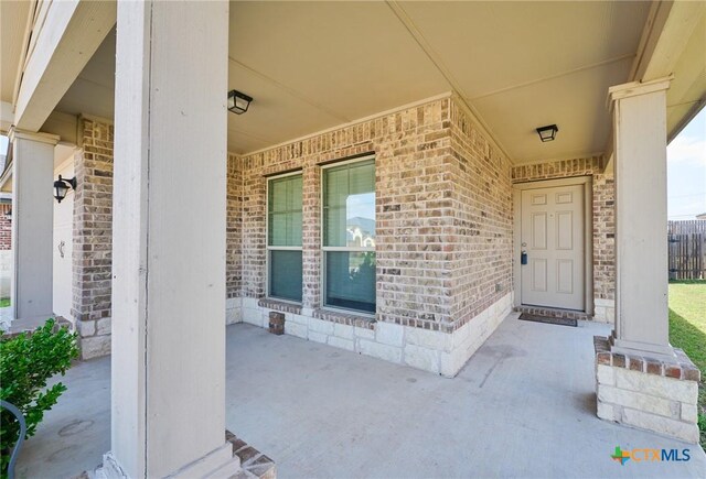 6409 Katy Creek Ln, Killeen, TX 76549 - view of exterior entry featuring brick siding and covered porch