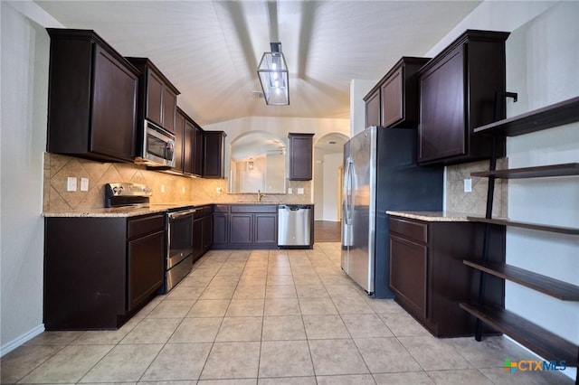 6409 Katy Creek Ln, Killeen, TX 76549 - kitchen featuring stainless steel appliances, open shelves, tasteful backsplash, and a sink
