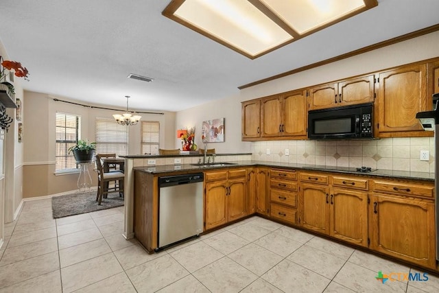 312 Beaver Loop, Temple, TX 76502 - kitchen with black appliances, brown cabinetry, a chandelier, and a peninsula