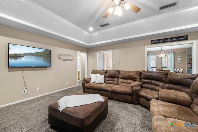 312 Beaver Loop, Temple, TX 76502 - carpeted living area featuring ceiling fan and a tray ceiling