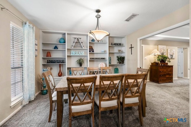 312 Beaver Loop, Temple, TX 76502 - dining space with light colored carpet and built in shelves