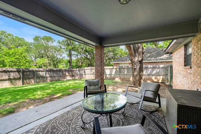 312 Beaver Loop, Temple, TX 76502 - fenced backyard featuring a patio