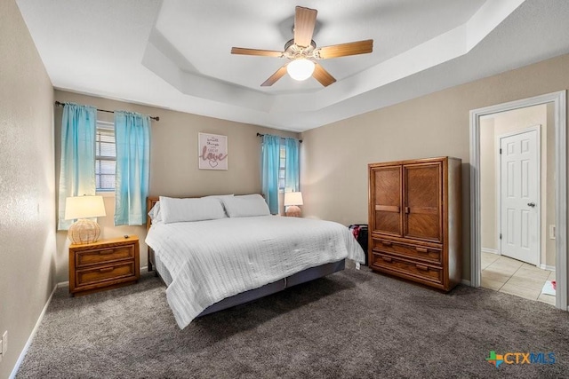 312 Beaver Loop, Temple, TX 76502 - bedroom with carpet, a tray ceiling, and ceiling fan