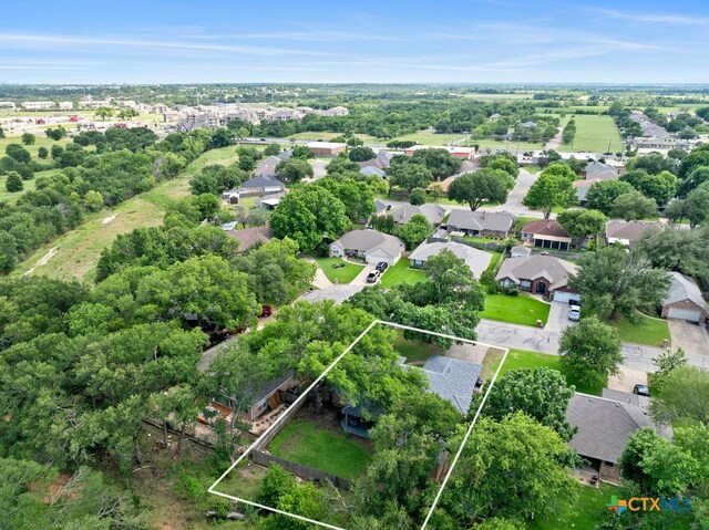 312 Beaver Loop, Temple, TX 76502 - aerial perspective of suburban area with property boundaries highlighted and a tree filled landscape