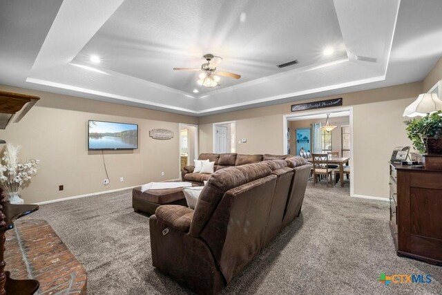 312 Beaver Loop, Temple, TX 76502 - carpeted living room with a raised ceiling, a ceiling fan, and recessed lighting