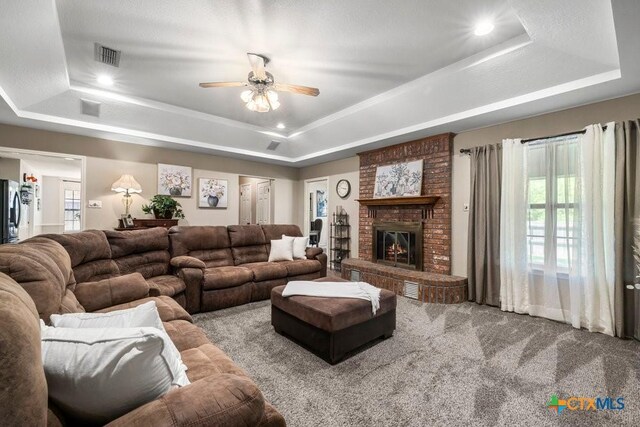 312 Beaver Loop, Temple, TX 76502 - living area featuring a raised ceiling, carpet flooring, a ceiling fan, a fireplace, and recessed lighting
