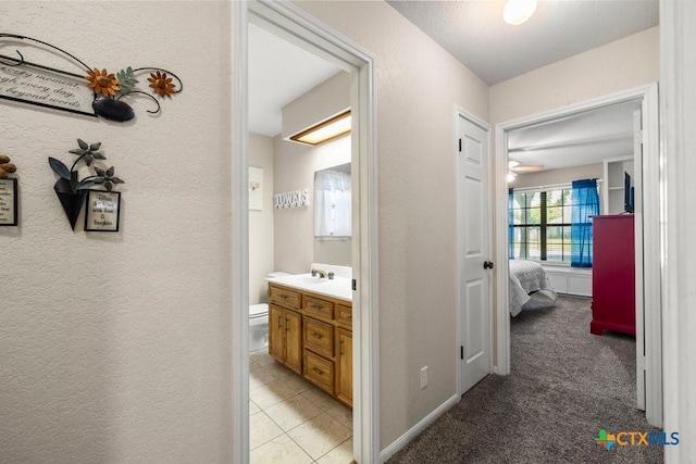 312 Beaver Loop, Temple, TX 76502 - hall featuring a textured wall and light colored carpet