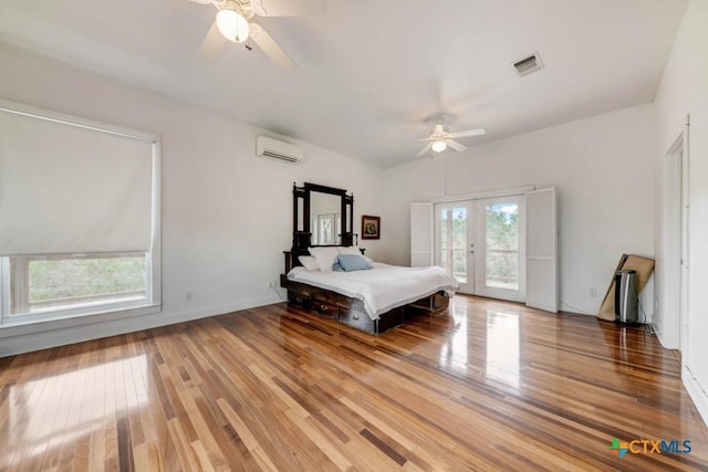 bedroom with visible vents, ceiling fan, light wood-style flooring, and access to exterior