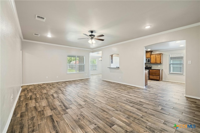 unfurnished living room with hardwood / wood-style floors, ceiling fan, and crown molding