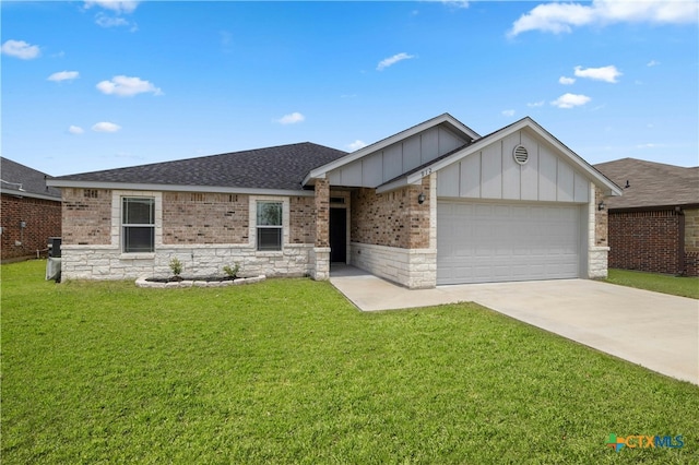 view of front of home with a garage and a front yard