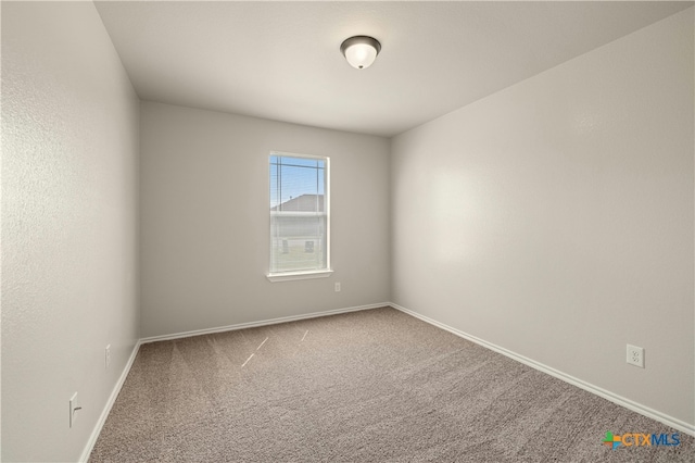 unfurnished room featuring carpet flooring