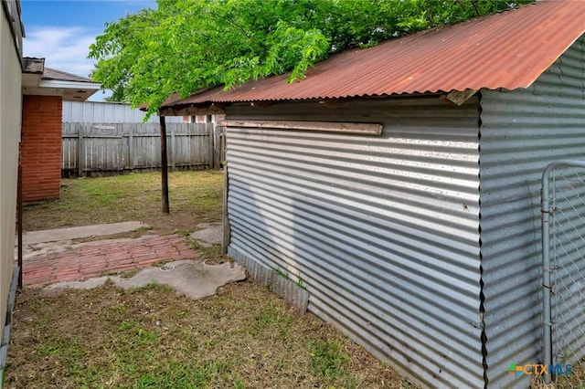 view of outbuilding with fence