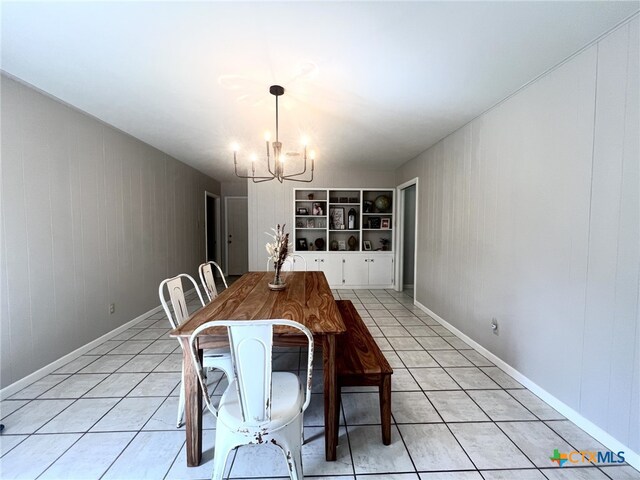 kitchen with brown cabinets, light countertops, appliances with stainless steel finishes, light tile patterned flooring, and a peninsula