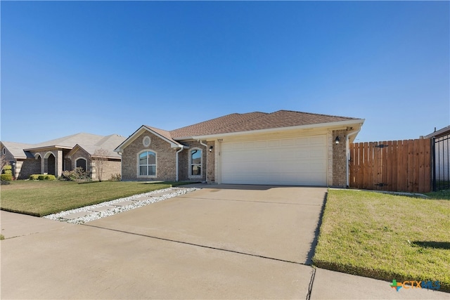 ranch-style home featuring a garage and a front lawn
