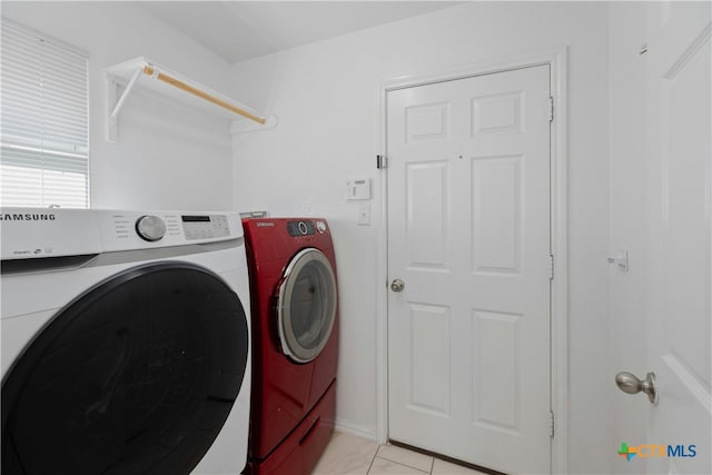 laundry area featuring washing machine and clothes dryer