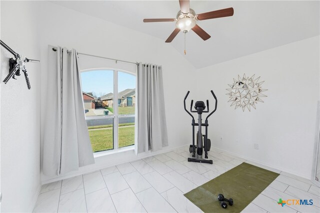 workout room with vaulted ceiling